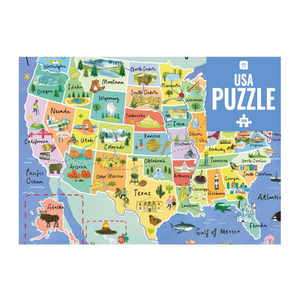 Photo of a 1000 piece puzzle of the USA. It includes all 50 states with illustrations on each state.
