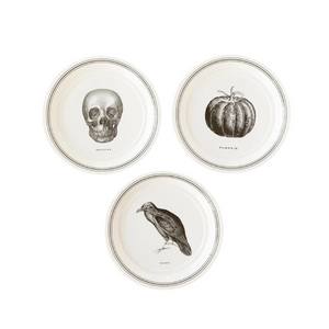 A set of 3 Halloween themed plates sits on a white background.