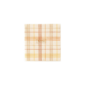 A photo of beige cocktail napkin with orange and yellow stripes making a plaid pattern. Perfect for fall parties.