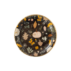 A photo of a packaged black plate with printed pumpkins and fall leaves. Perfect for Thanksgiving or Friendsgiving gatherings.