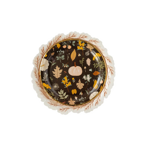 A photo of a black plate with printed pumpkins and fall leaves. Perfect for Thanksgiving or Friendsgiving gatherings.