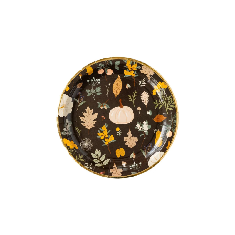 A photo of a black plate with printed pumpkins and fall leaves. Perfect for Thanksgiving or Friendsgiving gatherings.
