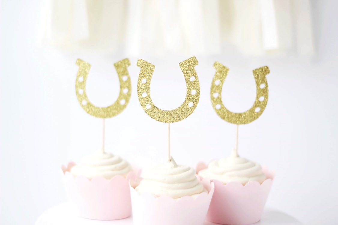 Three gold glittery horseshoe topper.