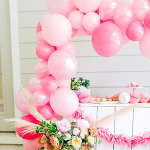 A close up view shows the garland and other pretty decorations made from florals and tissue.