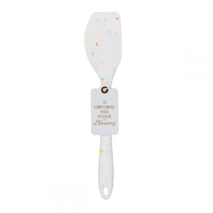 A silicone white confetti spatulas with a cute saying TO COMPLEMENT YOUR KITCHEN DANCING.