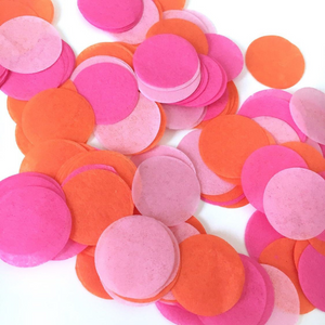 A close up shot shows detail of hot pink, pink, and orange one inch tissue confetti pieces.