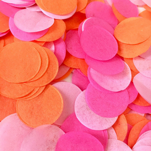 A close up shot shows detail of hot pink, pink, and orange one inch tissue confetti pieces.