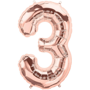 A rose gold number 3 balloon.