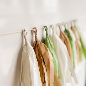 Set of 10 hand rolled tassels in the colors cream, tan, and sage.