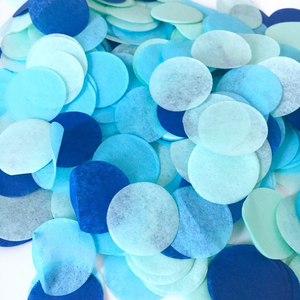 A close up photo of one inch tissue confetti shows the detail of the tissue. Example is shown in blue, oxford, and mint.