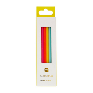 Photo of tall rainbow birthday candles in a white and yellow package.