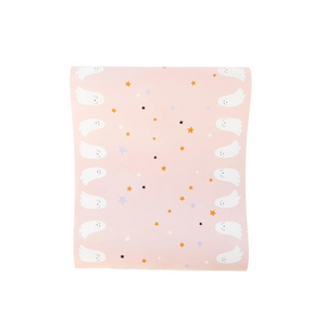 A photo of a cute pink table runner with white ghosts and orange, black, white, and gray stars.
