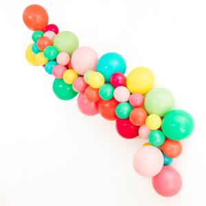 Balloon arch garland in the colors coral, wildberry, rose, pink, wintergreen, lime, caribbean blue, and yellow.