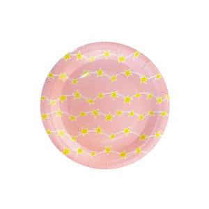 Pink dessert size plate with gold stars printed on it. 