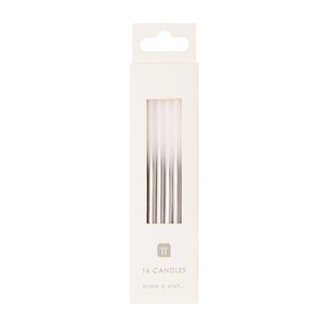 Photo of packaged 16 silver and white birthday candles on a white background.