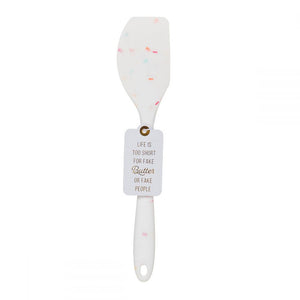 A silicone white confetti spatulas with a cute saying LIFE IS TOO SHORT FOR FAKE BUTTER OR FAKE PEOPLE.