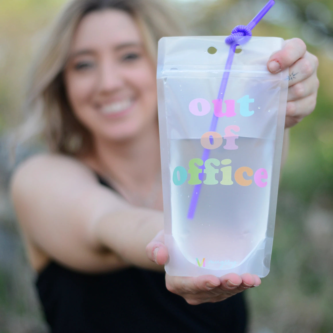 Plastic adult drink pouch with fun saying on each one and colorful twist straw.