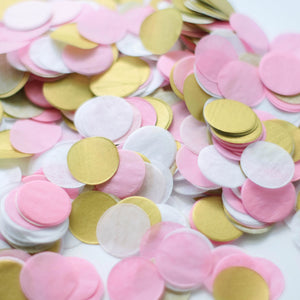 A pile of 1 inch handcut confetti circles in the colors pink, blush, white, and gold used in party celebrations, bachelorette, princess party, or girls birthday.